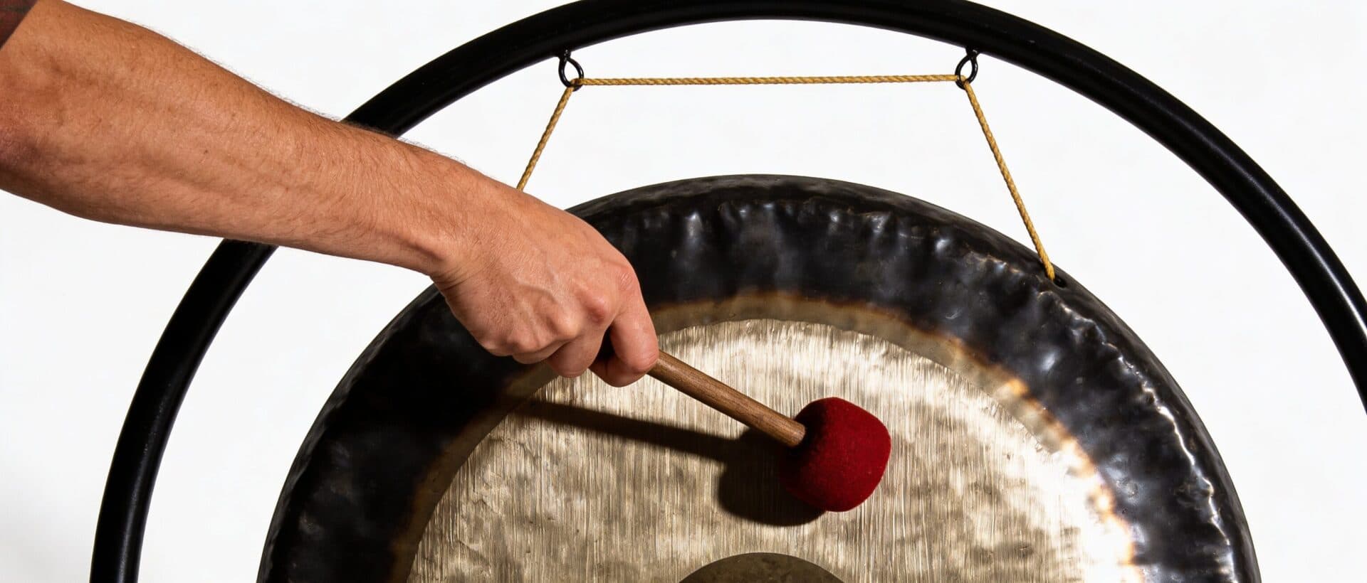 A practitioner playing a planetary gong